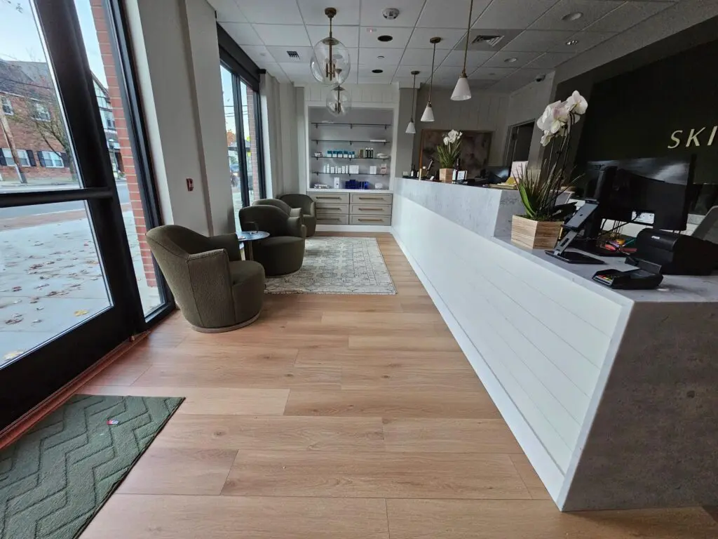 A lobby with chairs and tables in it