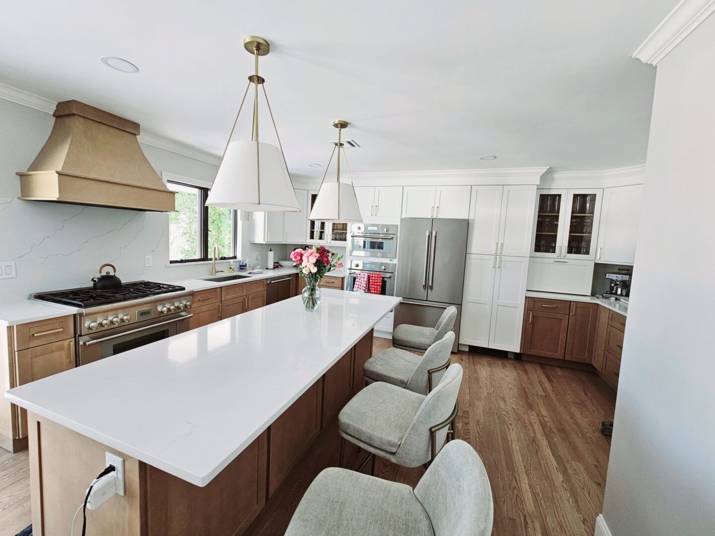 Modern kitchen with island and bar stools.