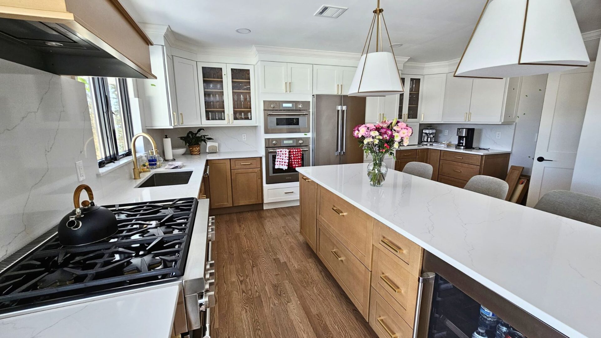 Kitchen with white and natural wood cabinetry